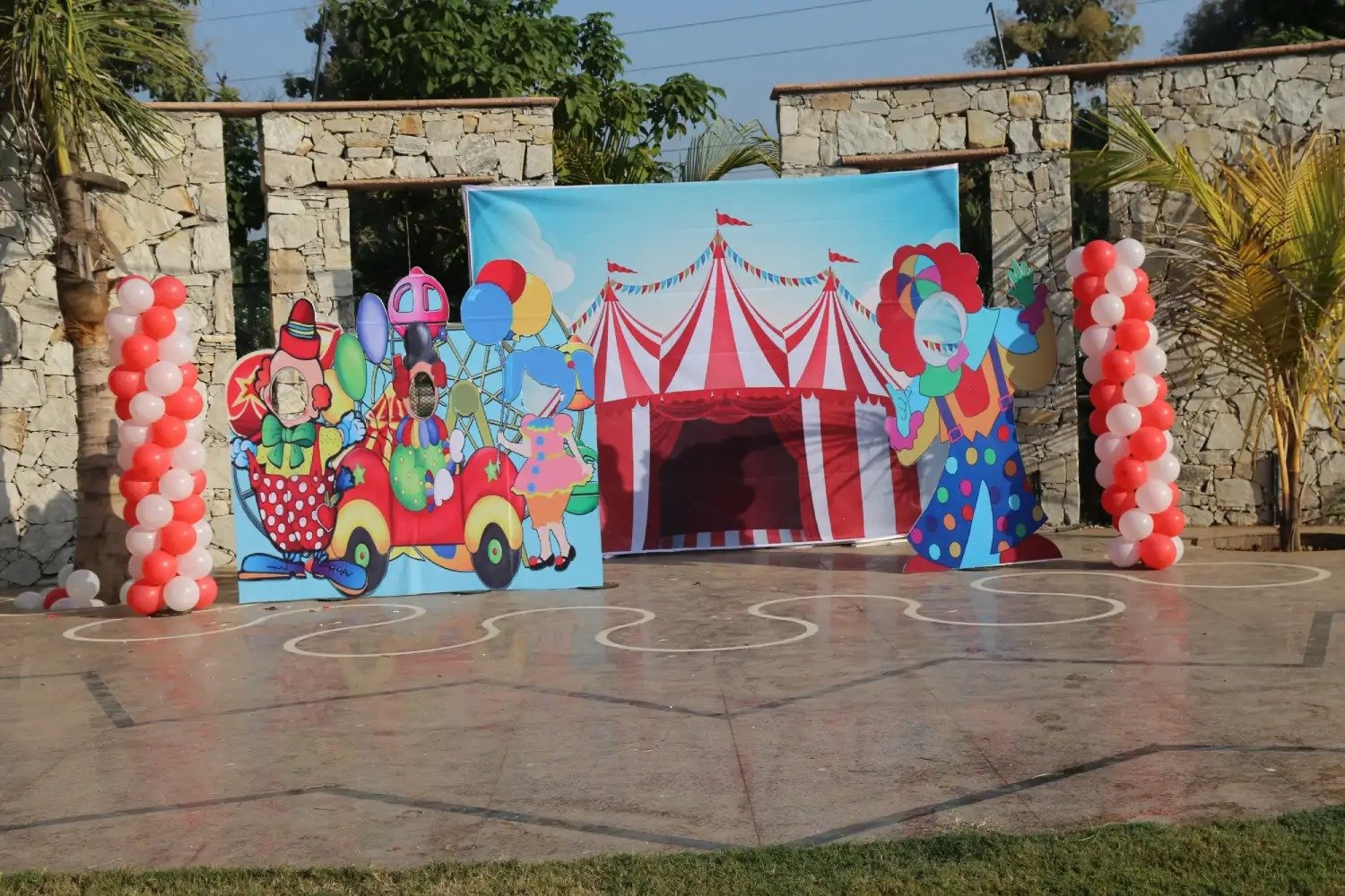 Man and woman speaking on stage at night with blue lighting